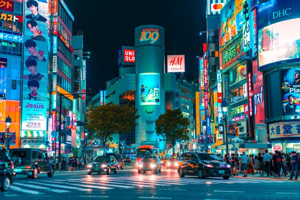 pictured: busy city street in Tokyo, Japan at night