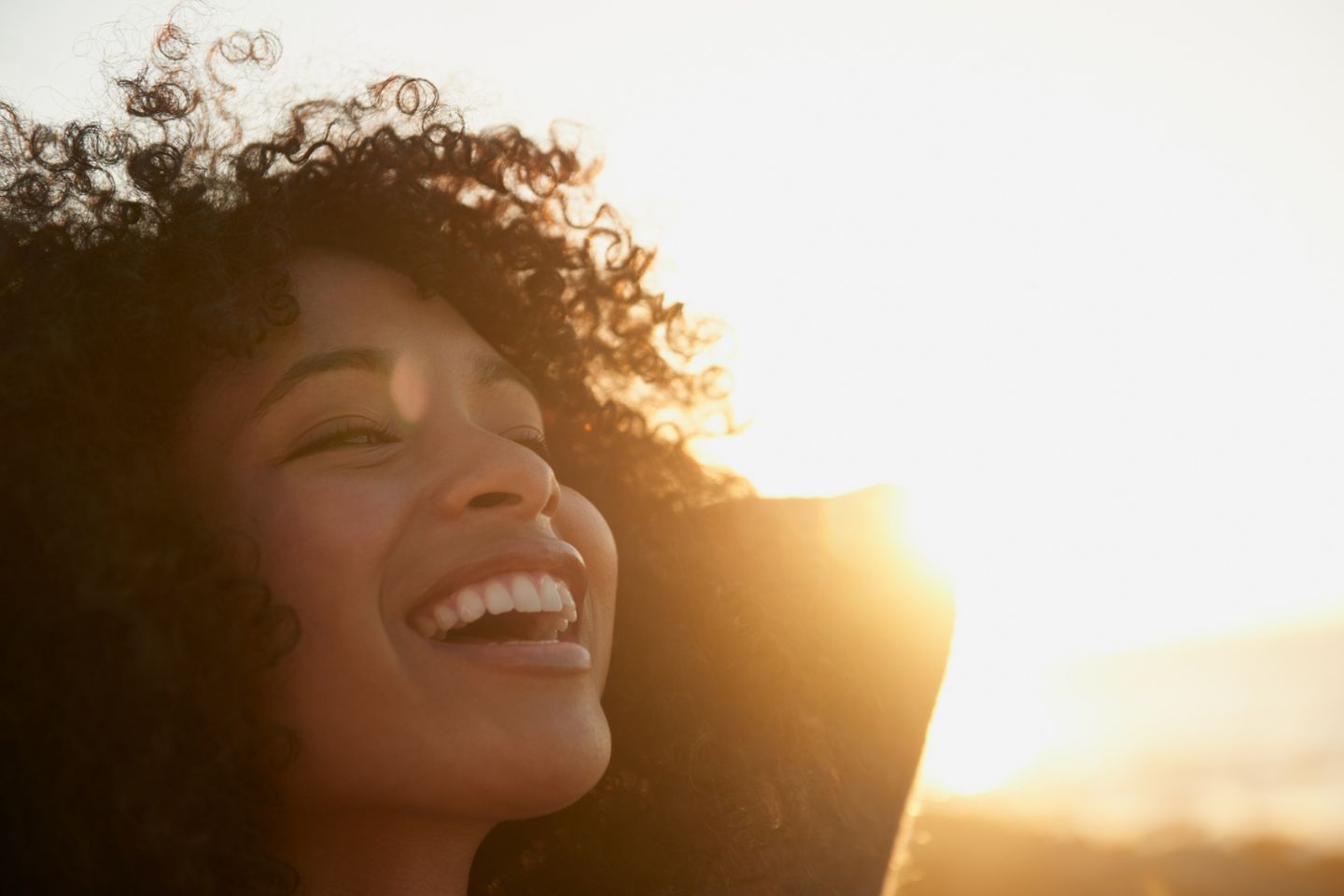 woman basking in the sun happily