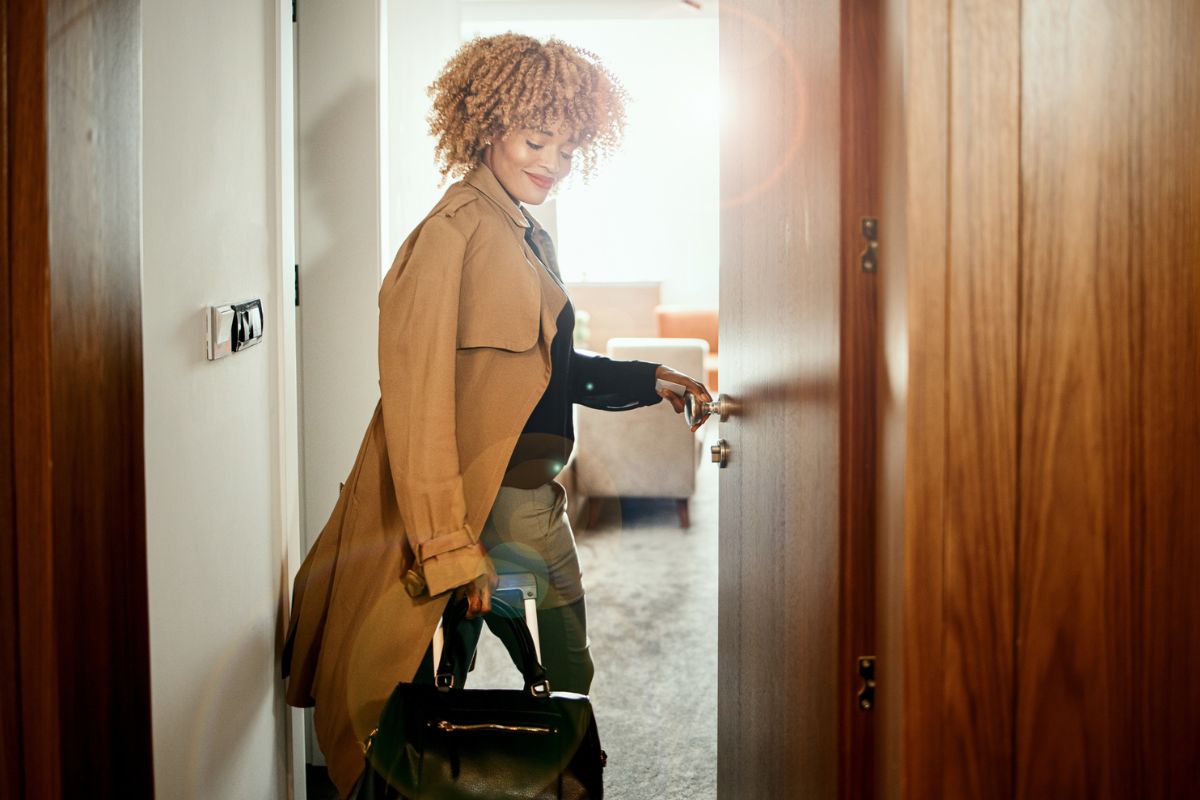 woman walking into a luxury hotel room