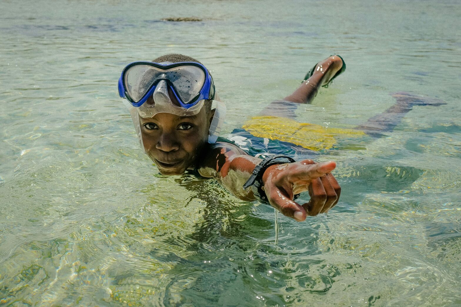 little boy snorkeling in the water