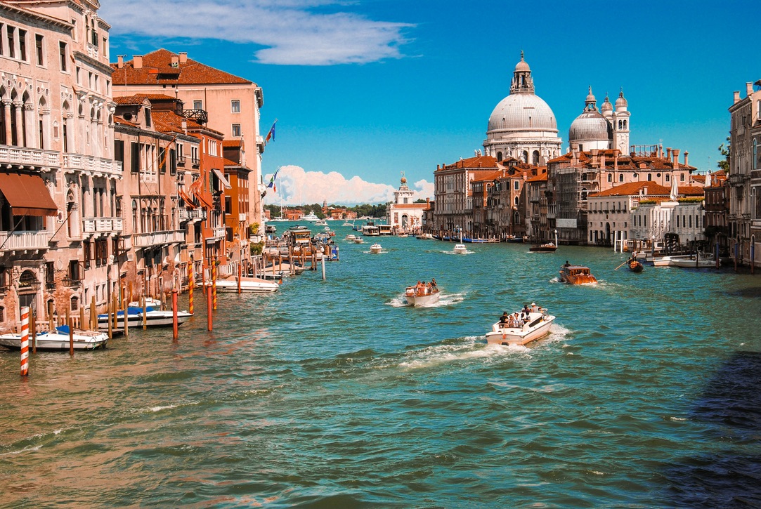 Check out the destinations in Italy that were filming locations for the Netflix series "Ripley". pictured: an image of the vibrant Italian city Venice during summer