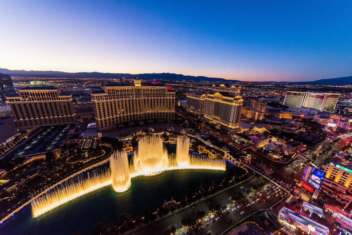 aerial view of las vegas at sunset with water fountain as the focal point