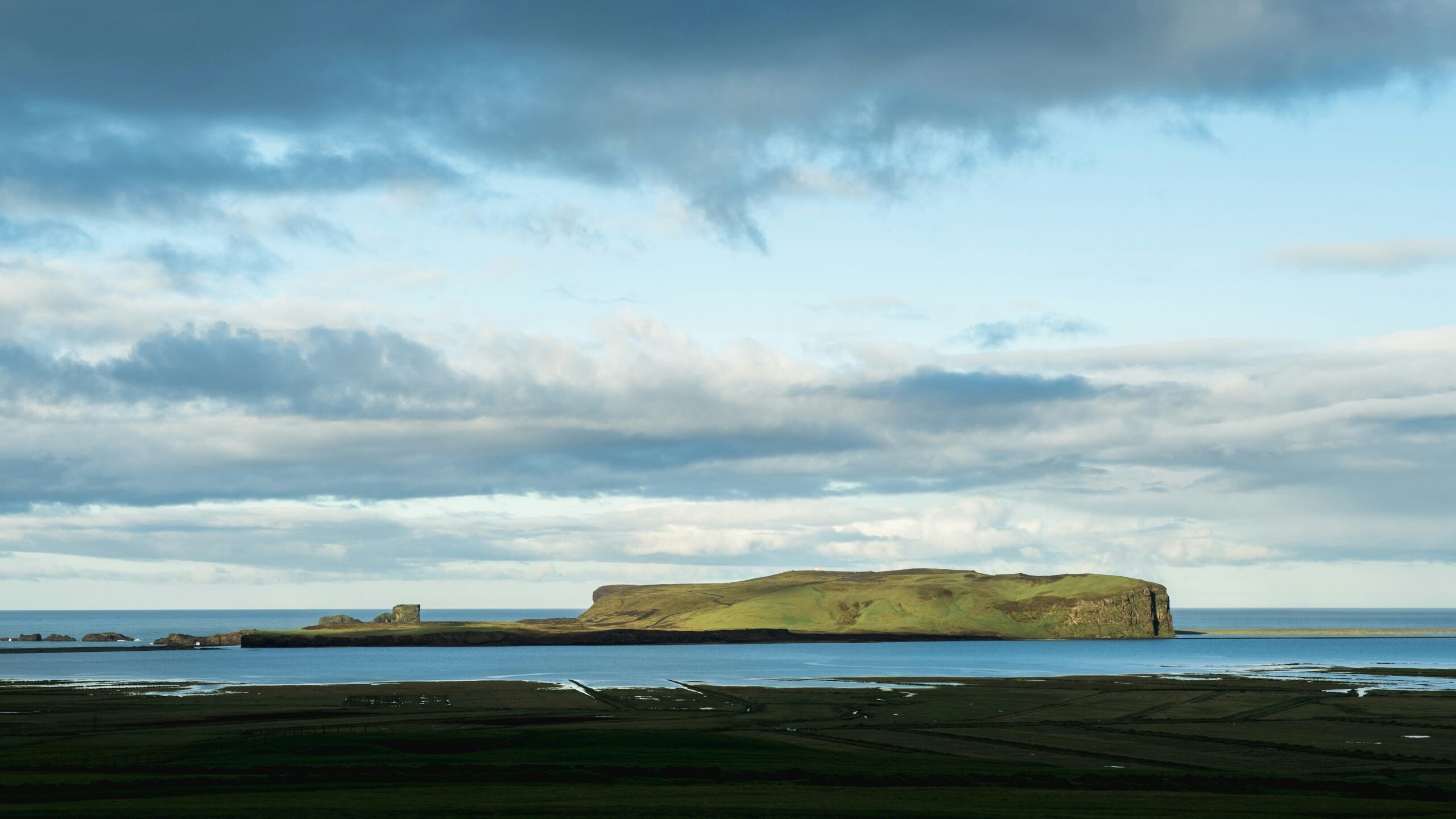 Learn about the weather conditions of August in Iceland. 
pictured: an isle off of Iceland