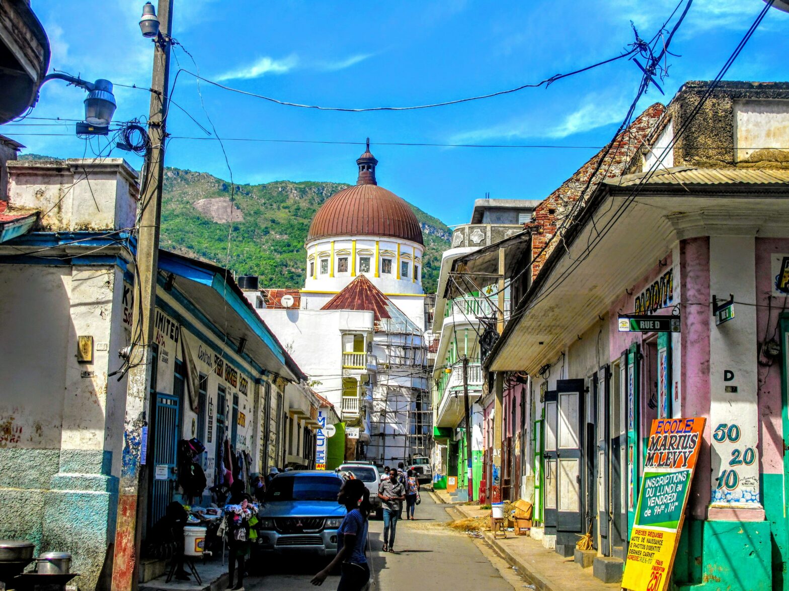 Learn about the dire situation in Haiti and how it impacts the travel industry. pictured: the vibrant streets of Haiti