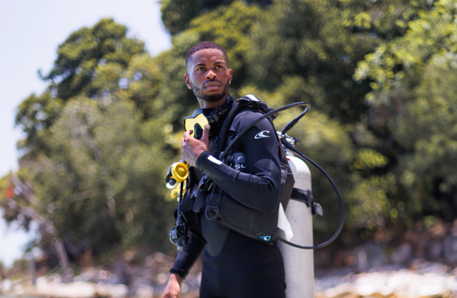 Barrington Scott on beach in scuba gear