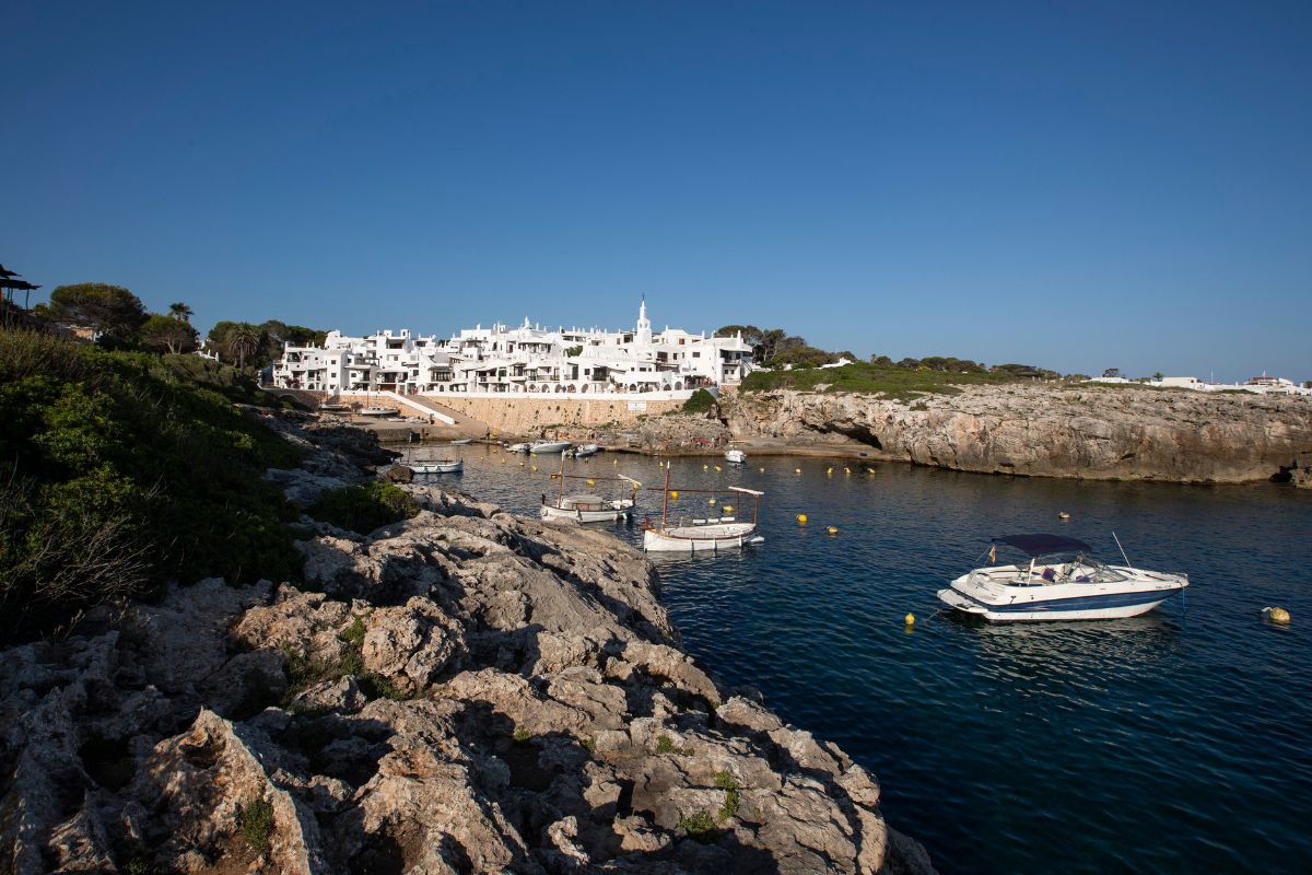 boats floating in a waterway overlooking Binibeca, Spain