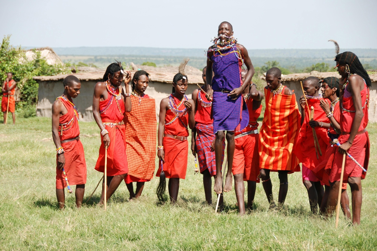 Maasai Tribe People Watching Man Jump