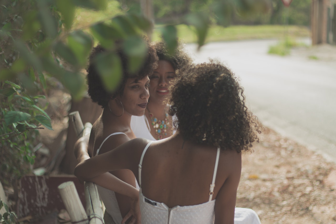 Learn more about the popular place that nudists are having their wedding at. 
pictured: Black women speaking in the Italian countryside