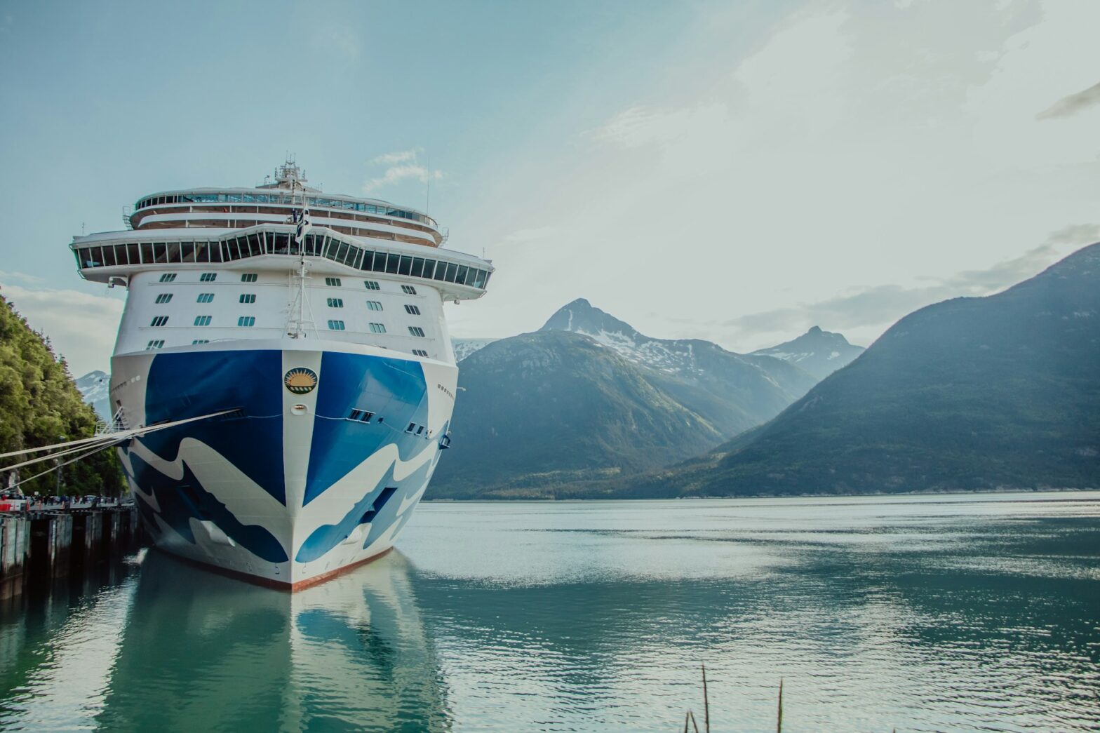 What to wear to an Alaska cruise in June. Pictured: a large cruise ship docked at a dock.