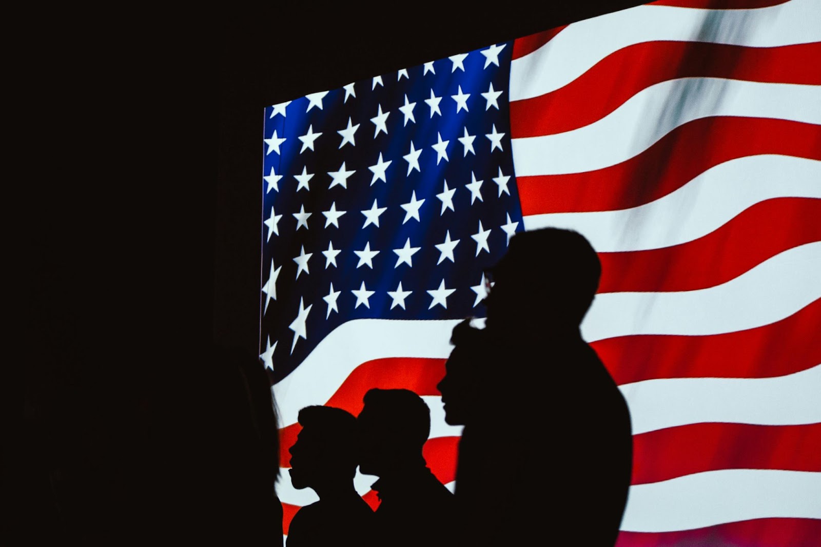 Palm Springs, California is a good place for travelers to spend on this holiday weekend.
pictured: people standing in front of the US flag  