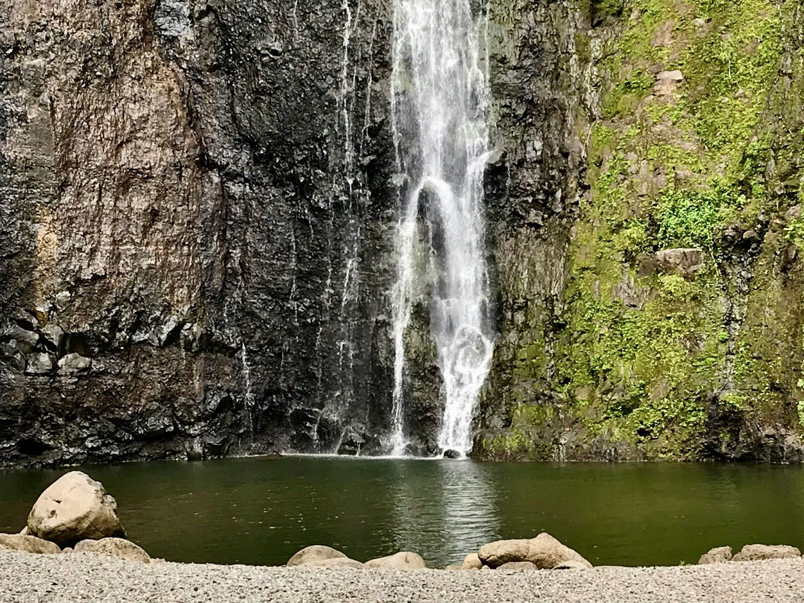 This waterfall is a top attraction for travelers visiting Tahiti in June. 
pictured: a waterfall in Tahiti