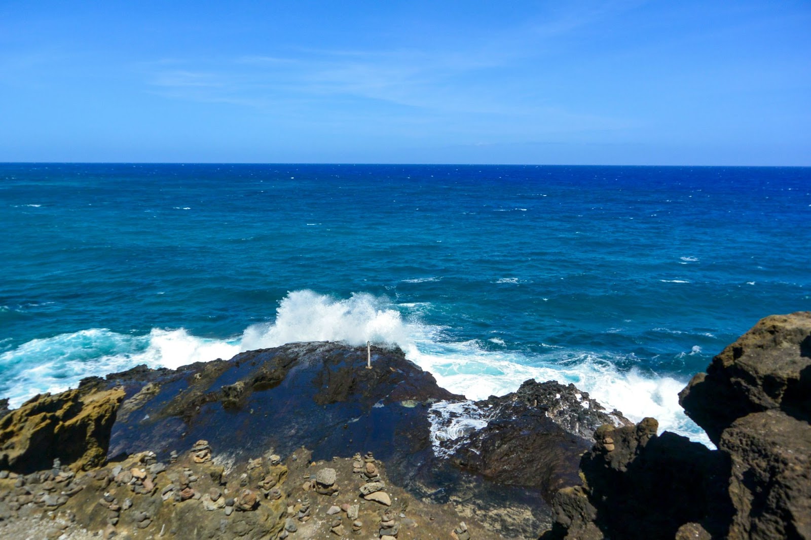 Learn more about the recent study to find the place with the bluest ocean water. 
pictured: a beach with crashing waves and very blue water 