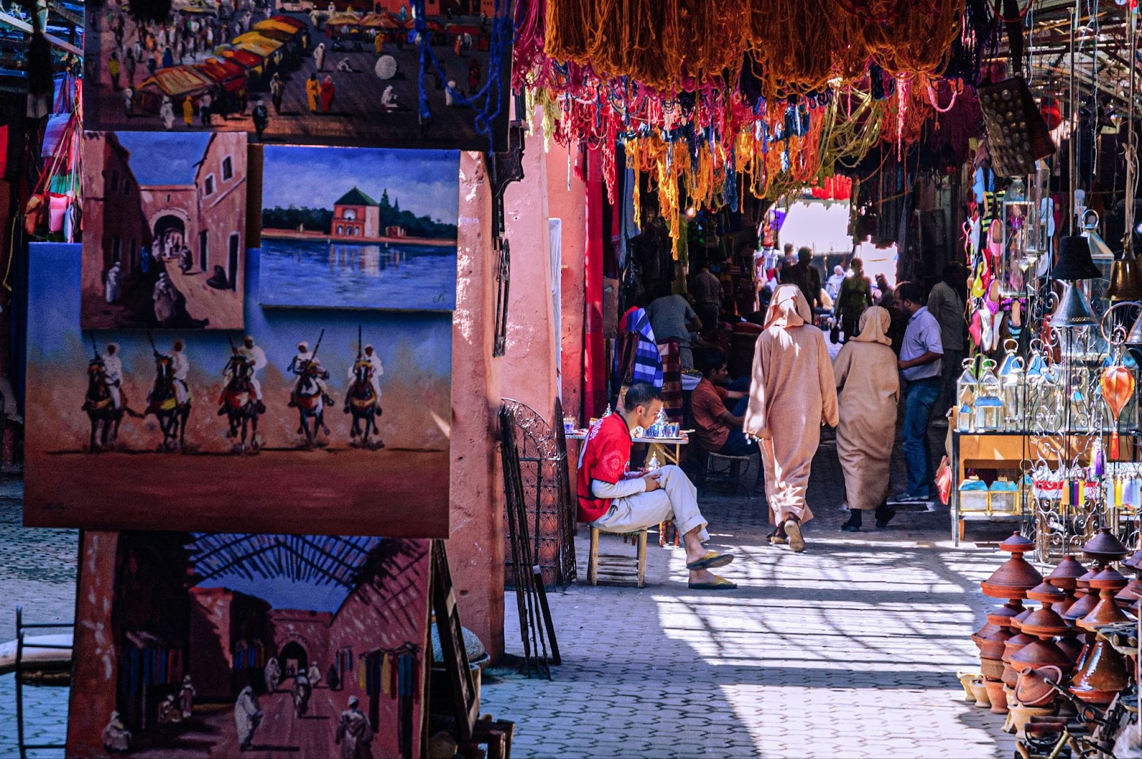 Travelers should visit souks during their trip during the best time to visit Morocco.
pictured: a souk in Morocco