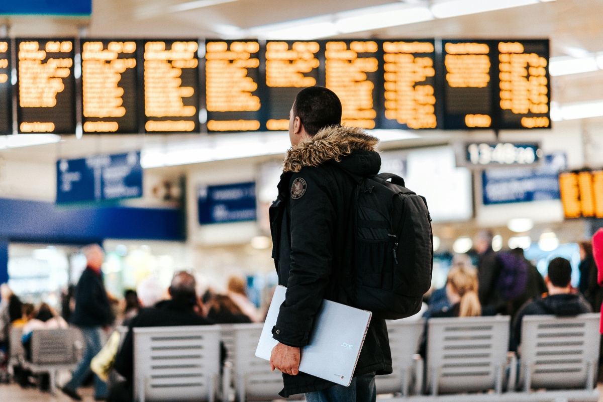 man standing inside an airport