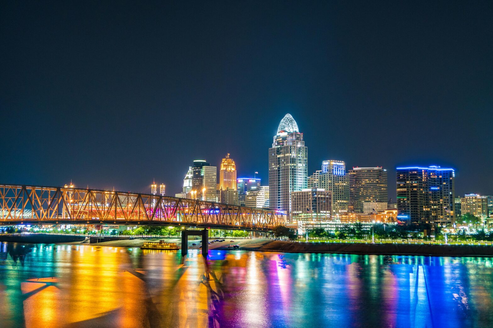 Lighted buildings near a river in Cincinnati, Ohio.