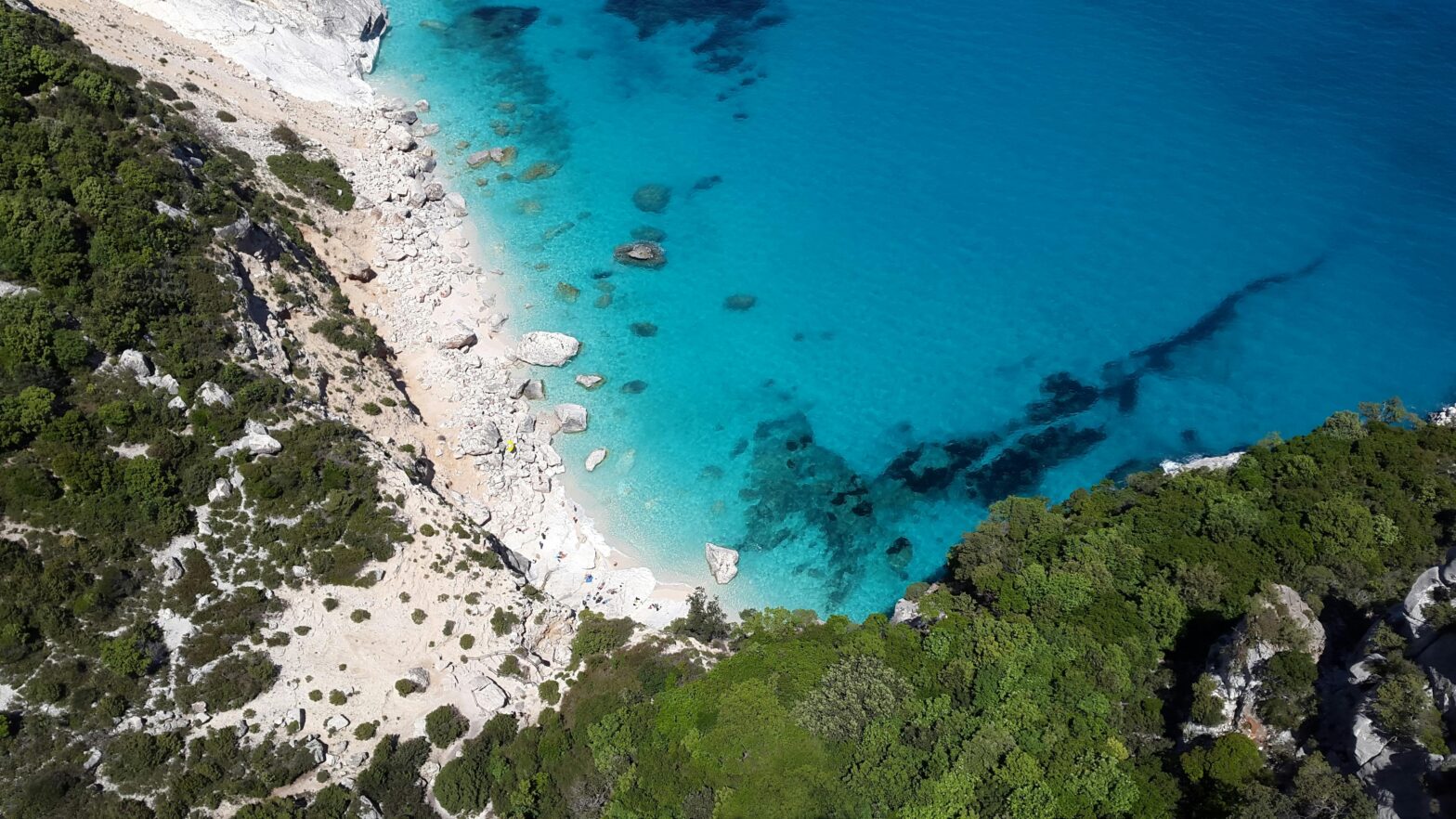 Photo of sea water and a cliff. Sardinia, Italy.