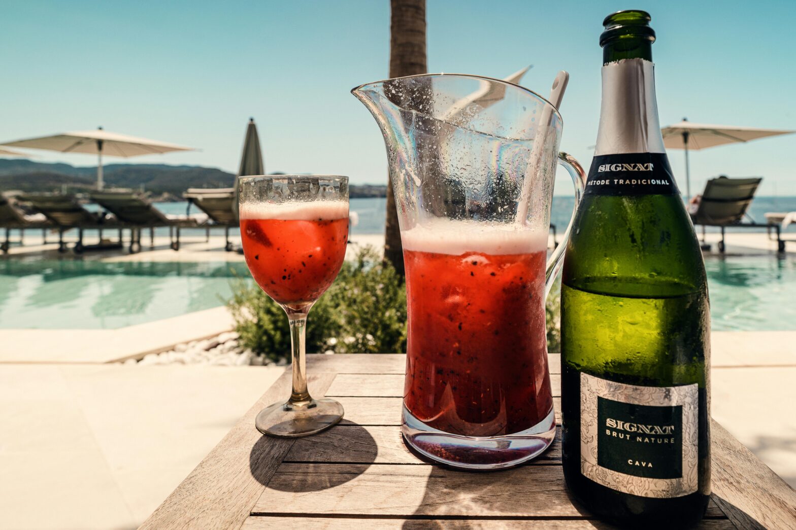 Sangria and champagne on table outside on a sunny day