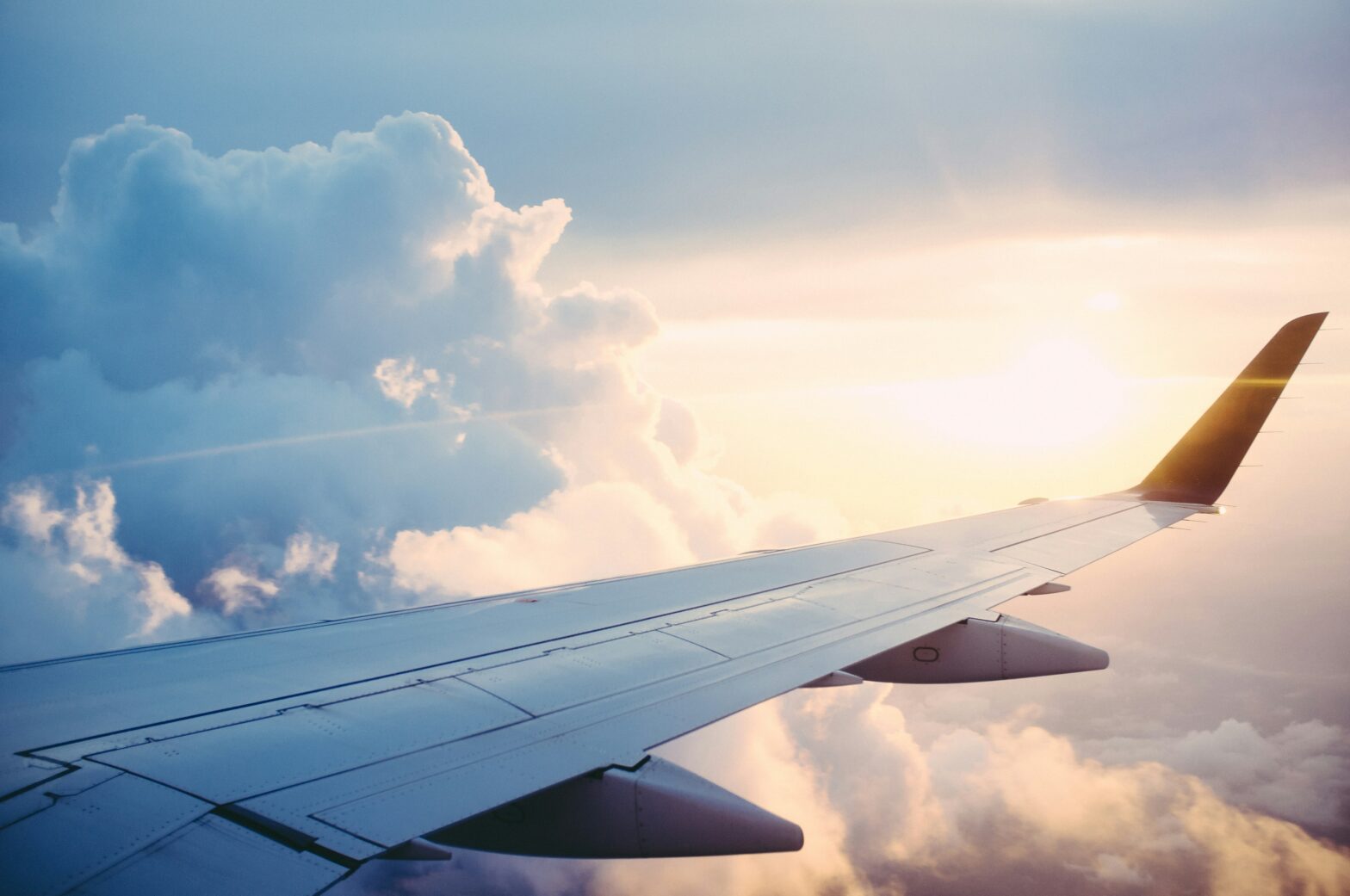 Airplane wing in the sky.