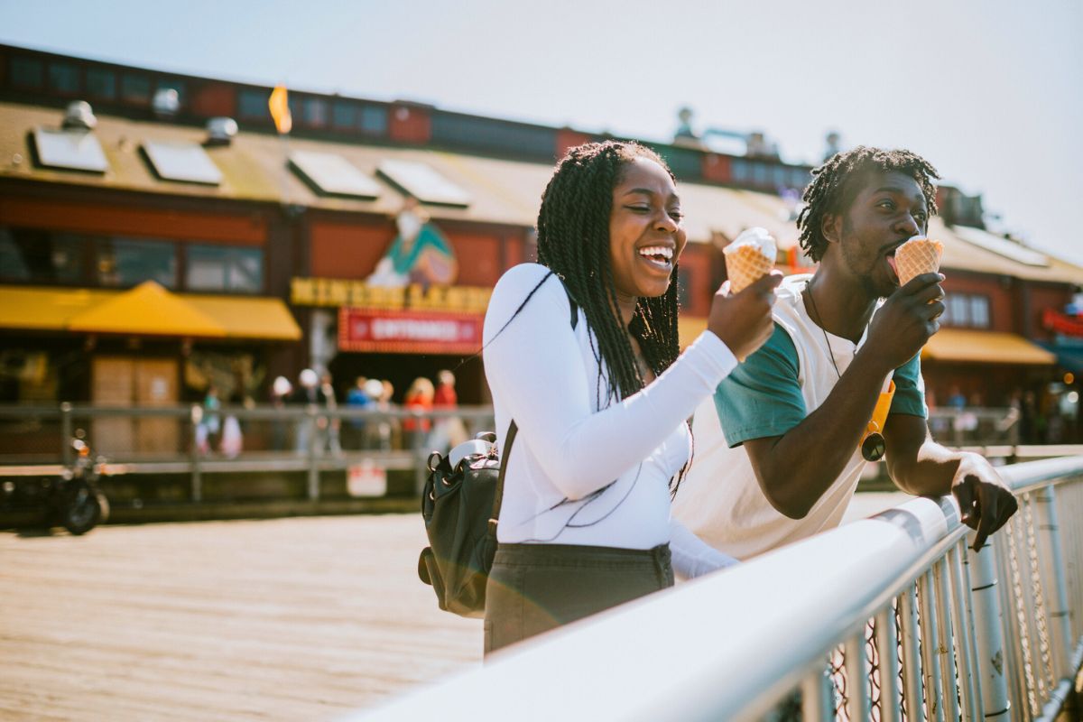 couple enjoying ice cream on Seattle Pier during the day