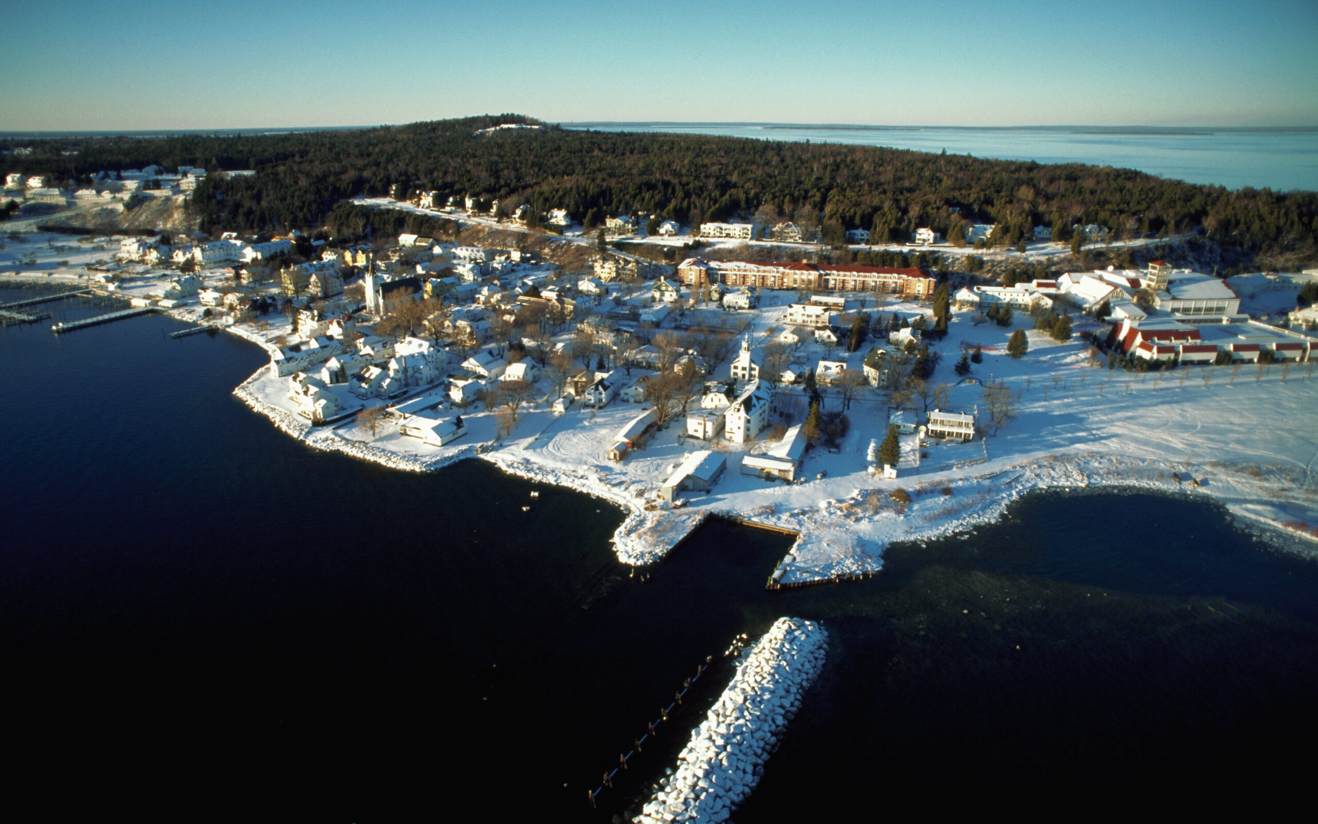 A waterfront town on Mackinac Island is covered with snow