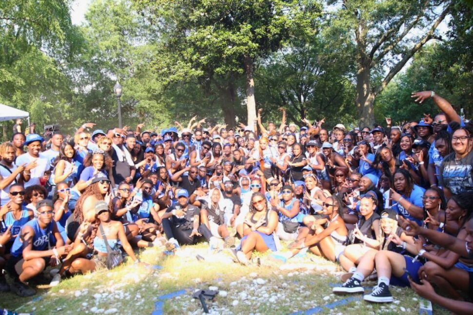 group of fraternity and sorority members at Atlanta Greek Picnic posing in group shot