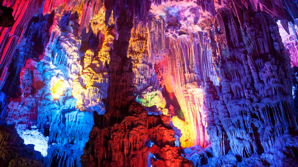 Inside the lit up Reed Flute Cave in China