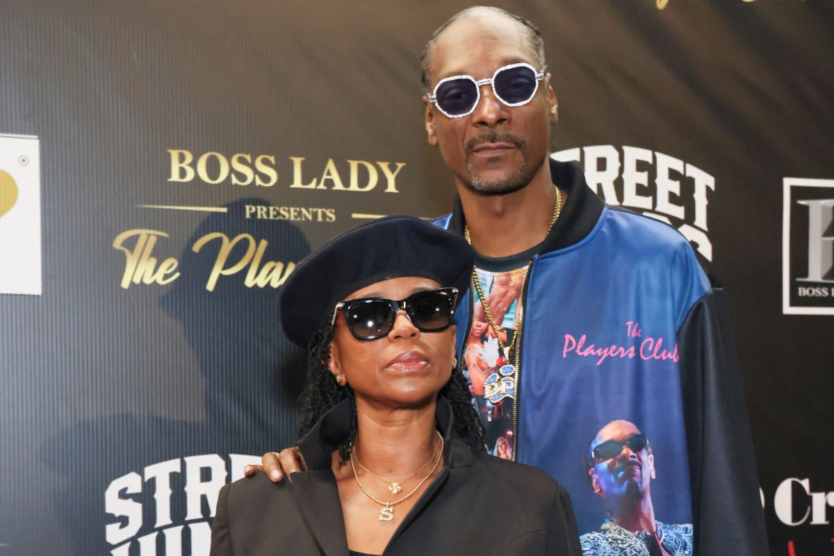 Shante "Boss Lady" Broadus and Snoop Dogg on red carpet at unveiling of The Players Club in Los Angeles, California