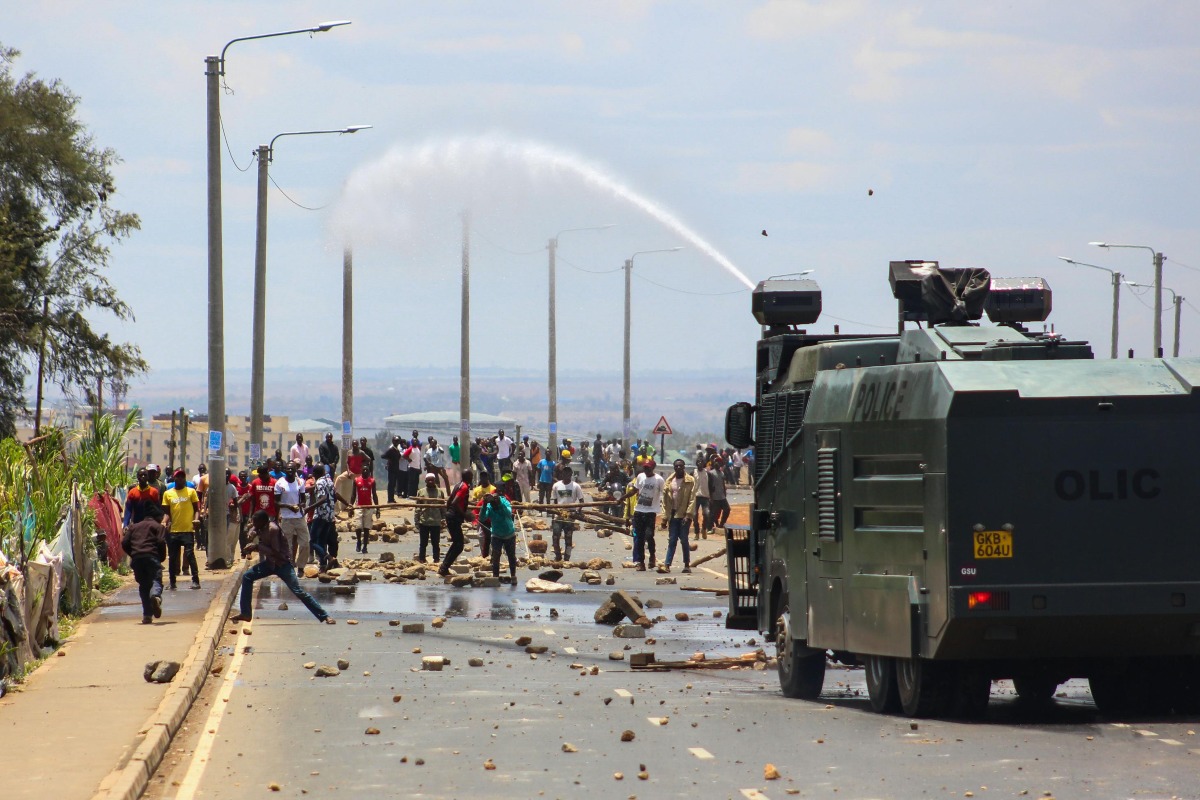 View of a Police Truck Spraying Water on Protesters on the Street in Nairobi, Kenya