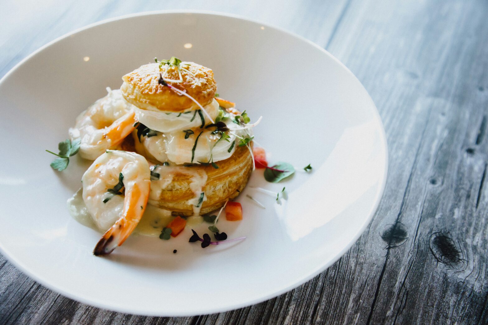 Plate of beautifully prepared food.