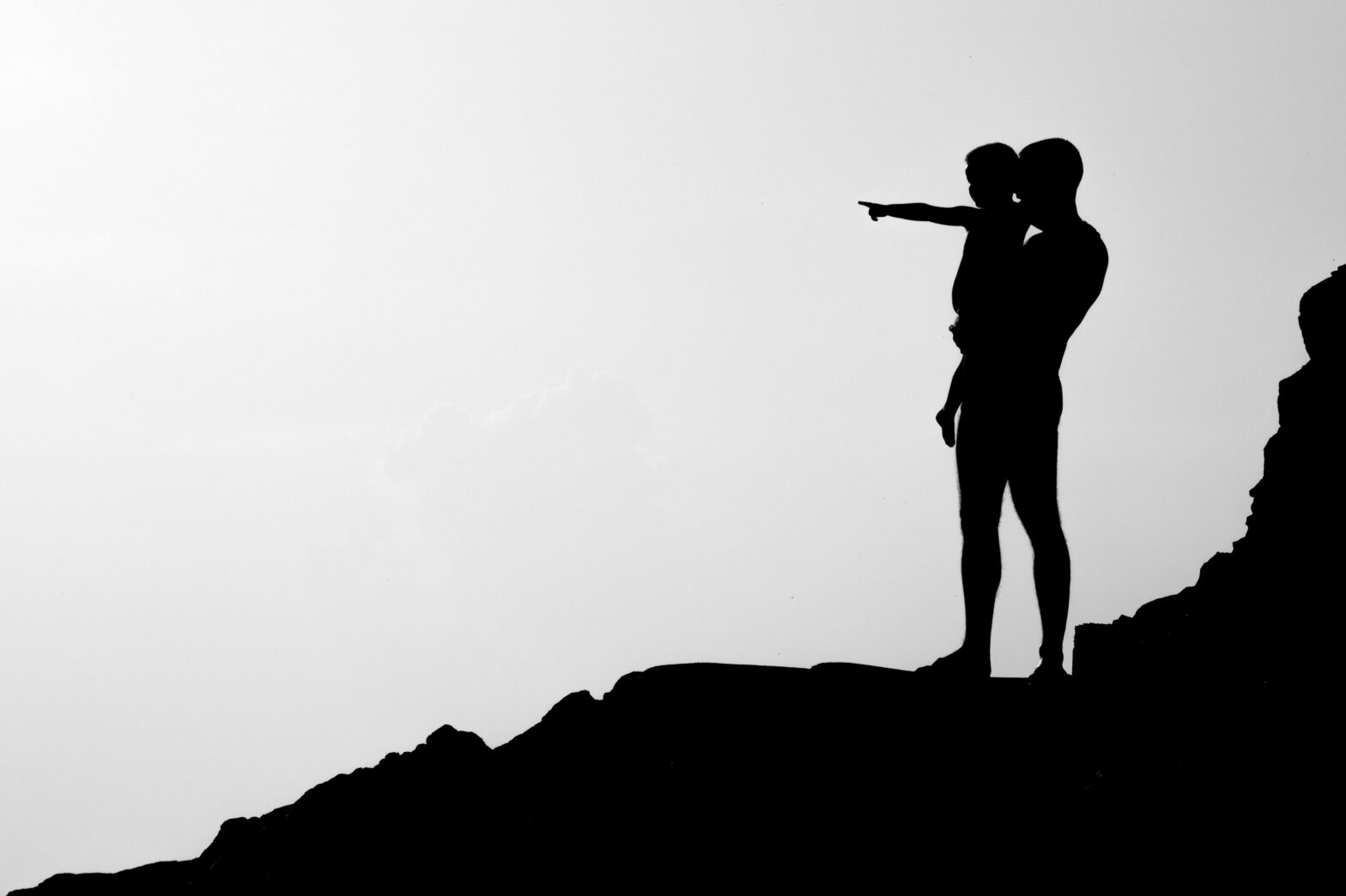 Father’s Day is a perfect day to take the dad in your life on a trip. Pictured: a Black dad and son enjoying the views