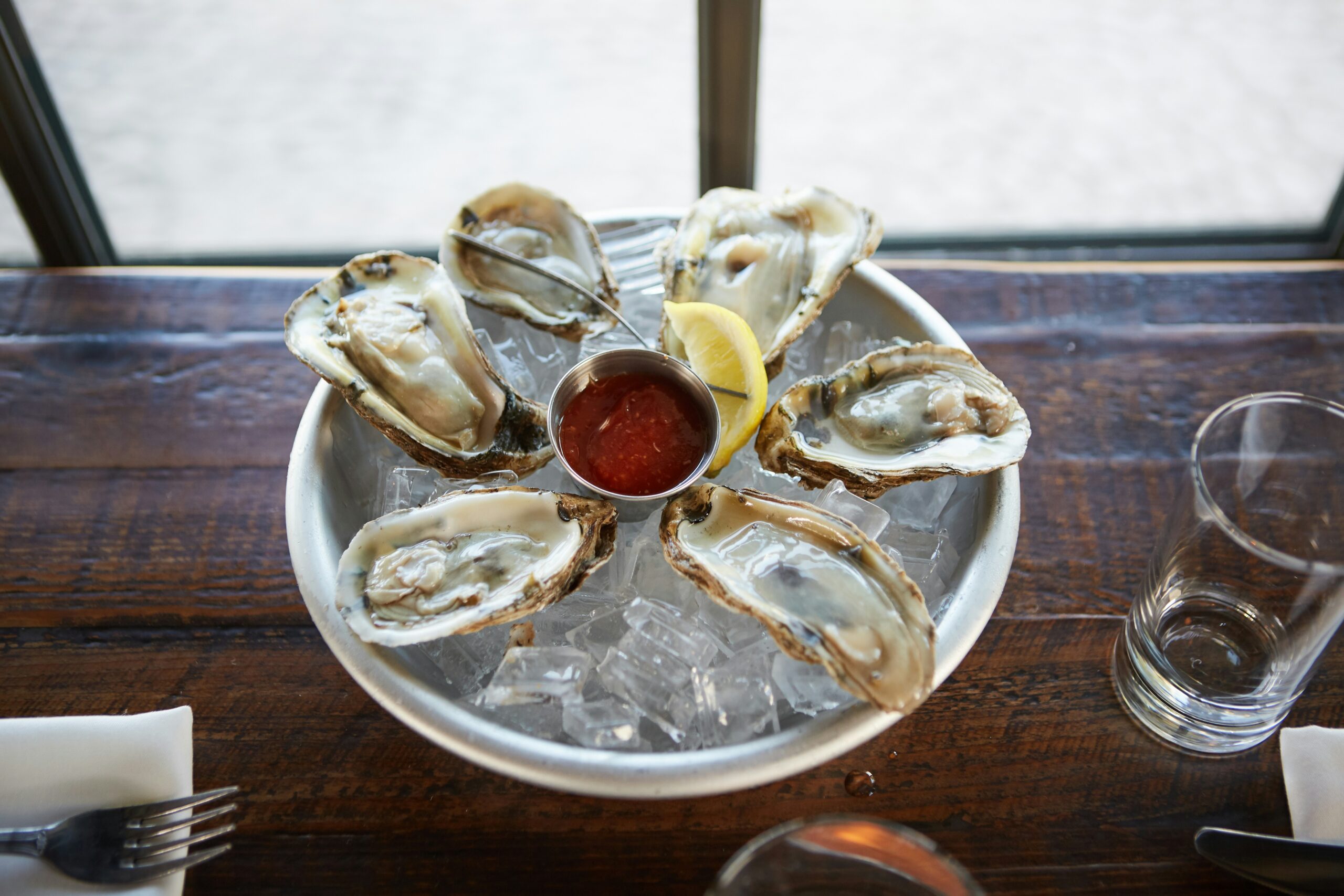 This unique oyster festival is one of the reasons travelers should visit South Africa in winter. 
Pictured: oysters 