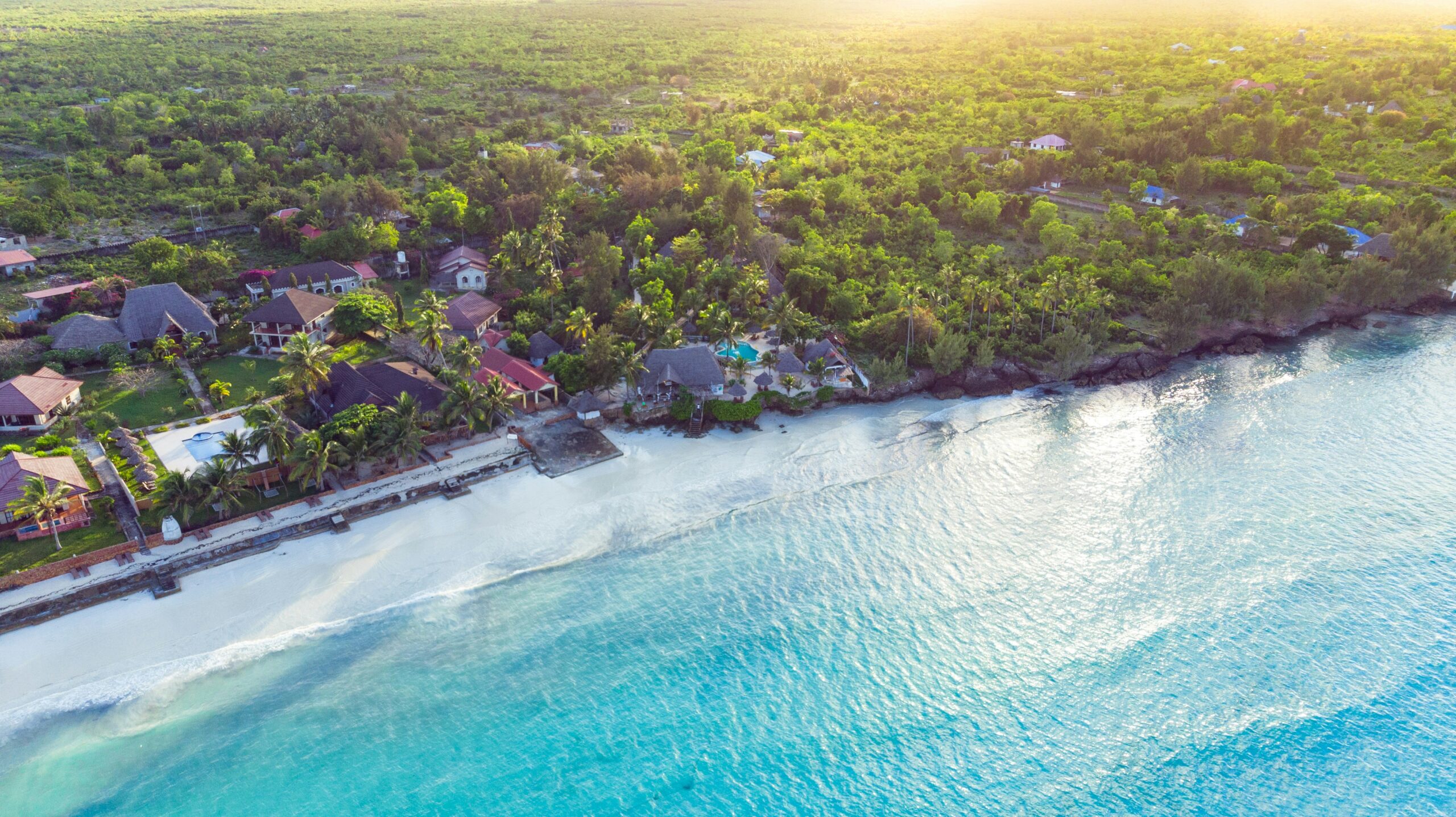 There are many relaxing beaches for travelers to visit in July.
Pictured: a beach in Tanzania 