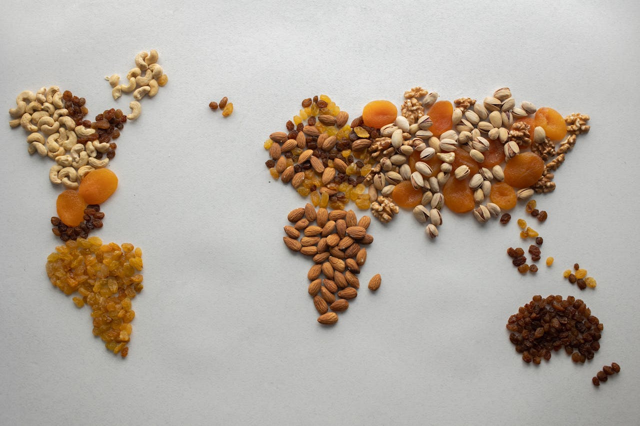 54 Food Trivia questions. cc: World map made of nuts and dried fruits.