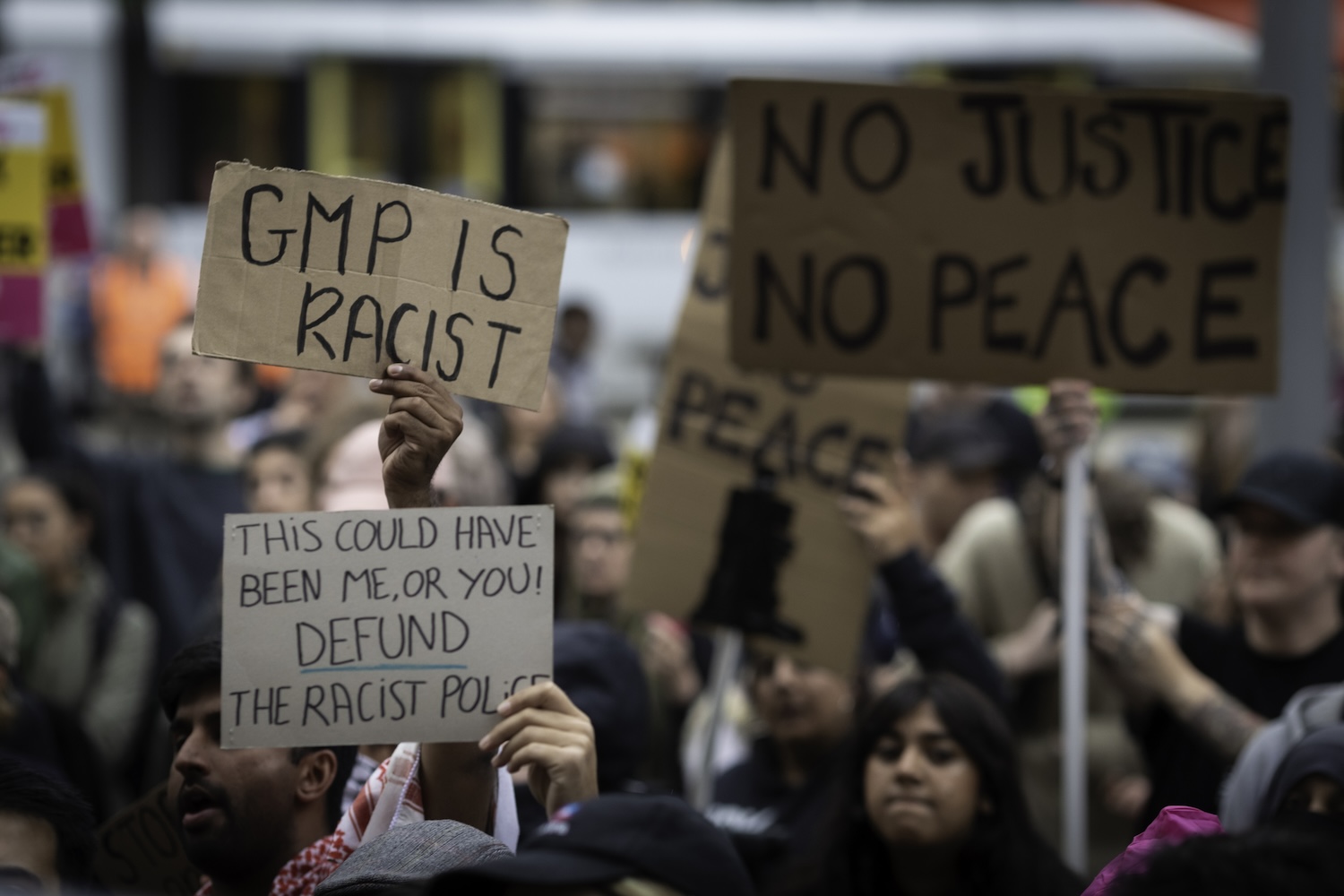 MANCHESTER, UNITED KINGDOM - 2024/07/25: Protesters hold placards during the demonstration against the Greater Manchester Police (GMP).