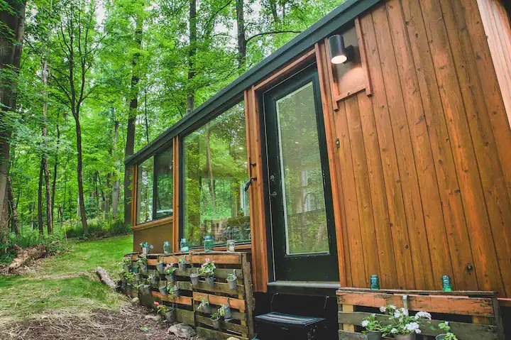 This tiny home is a great option for off the grid Airbnbs. 
Pictured: tiny home in nature