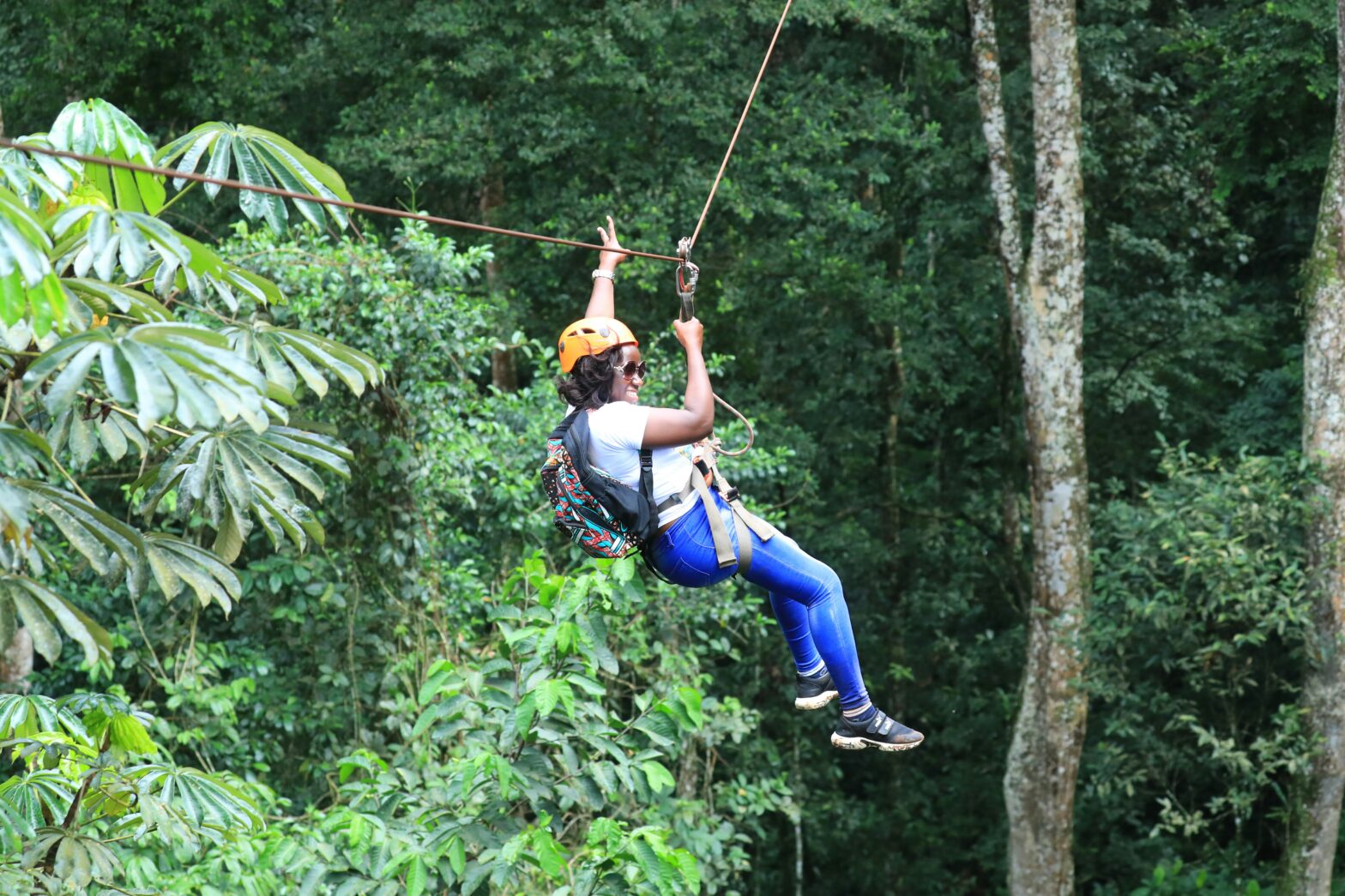 Black woman zip lining