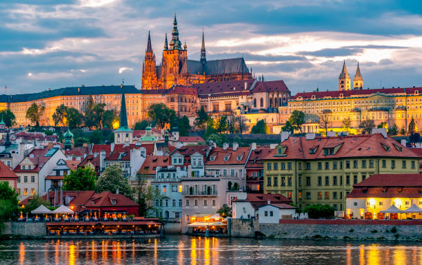 pictured: Prague Castle with St. Vitus Cathedral over Lesser town (Mala Strana) at sunset, Czech Republic