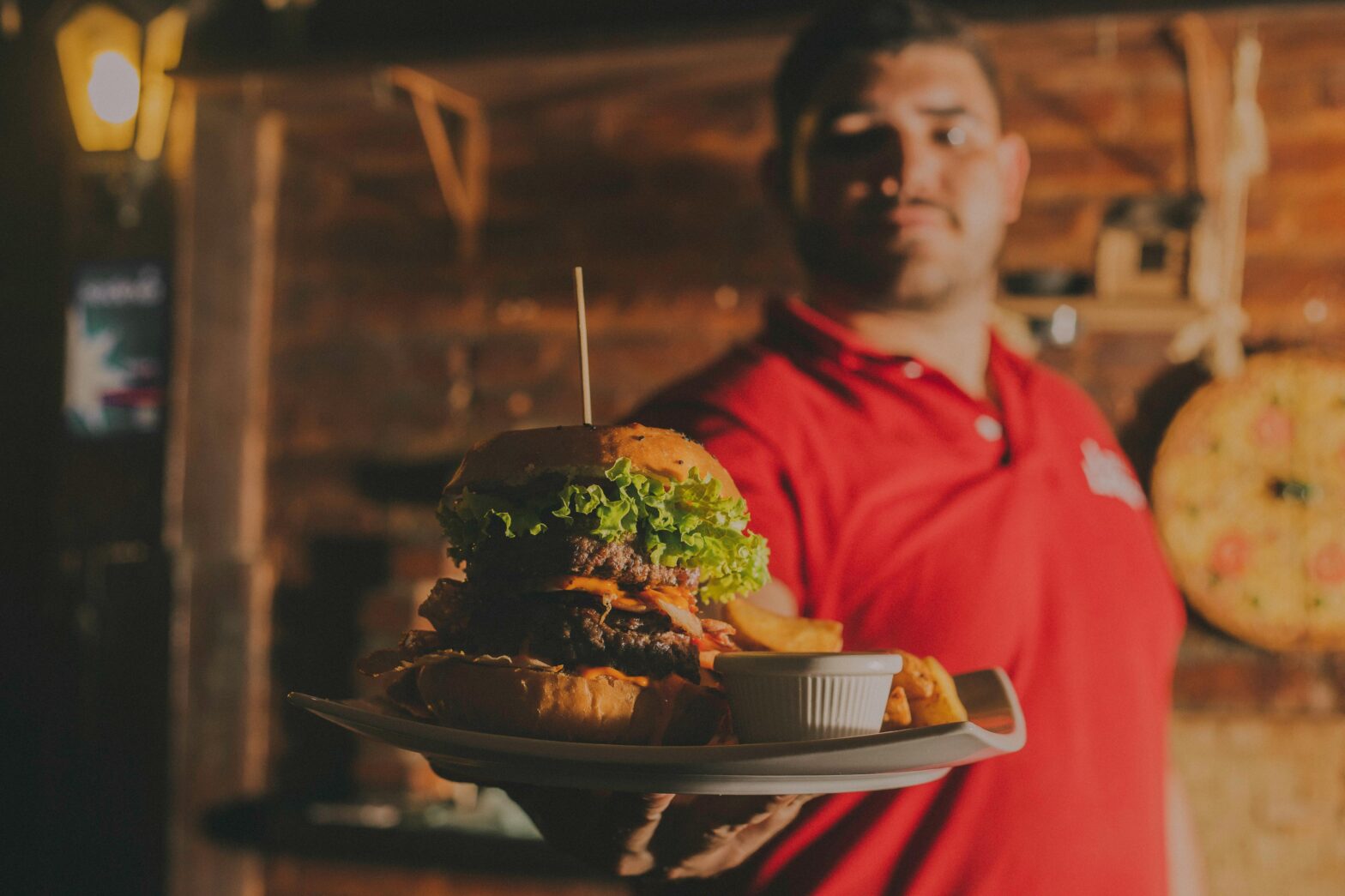 man holding out a plate of food