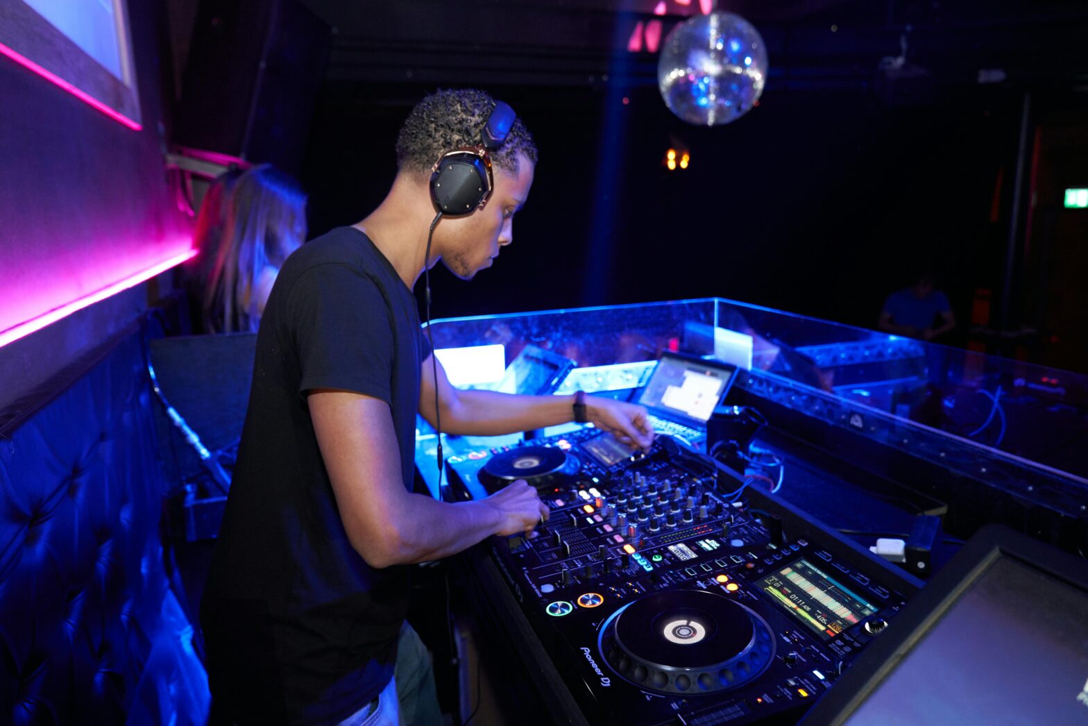 DJ performing at nightclub setting