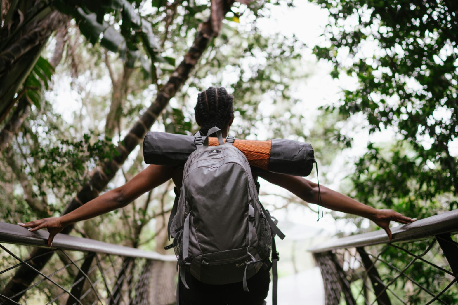 Travelers should check out these underrated national parks. pictured: Black person in nature