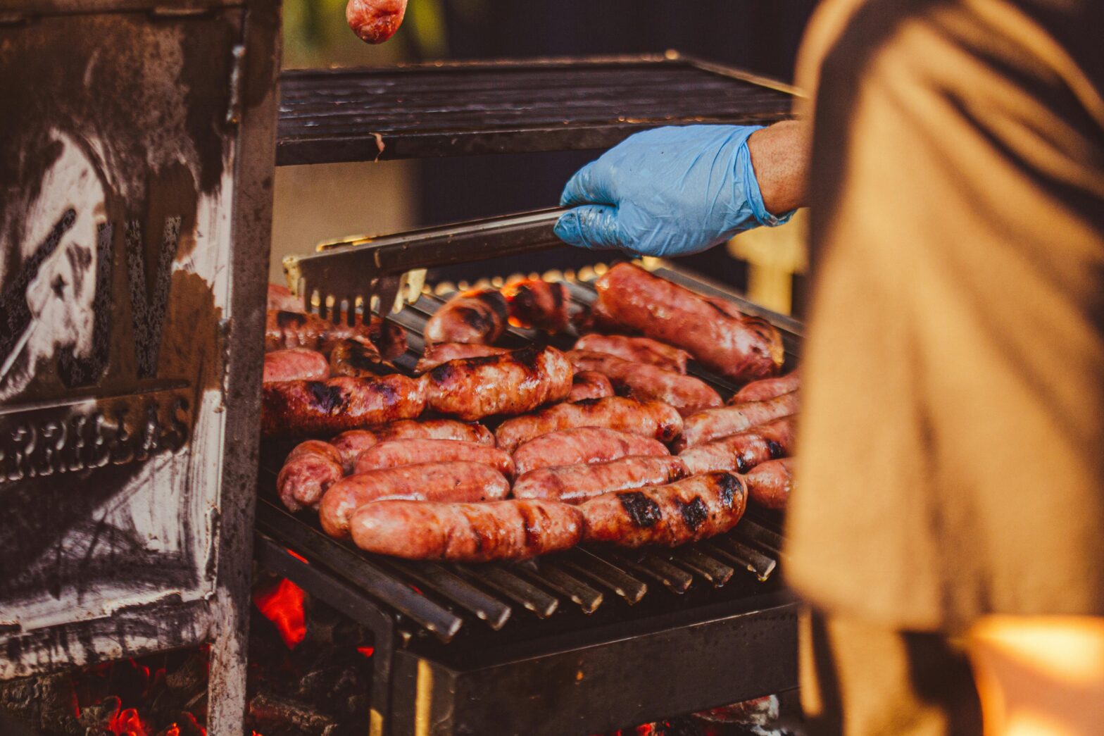 Man barbecuing meat.