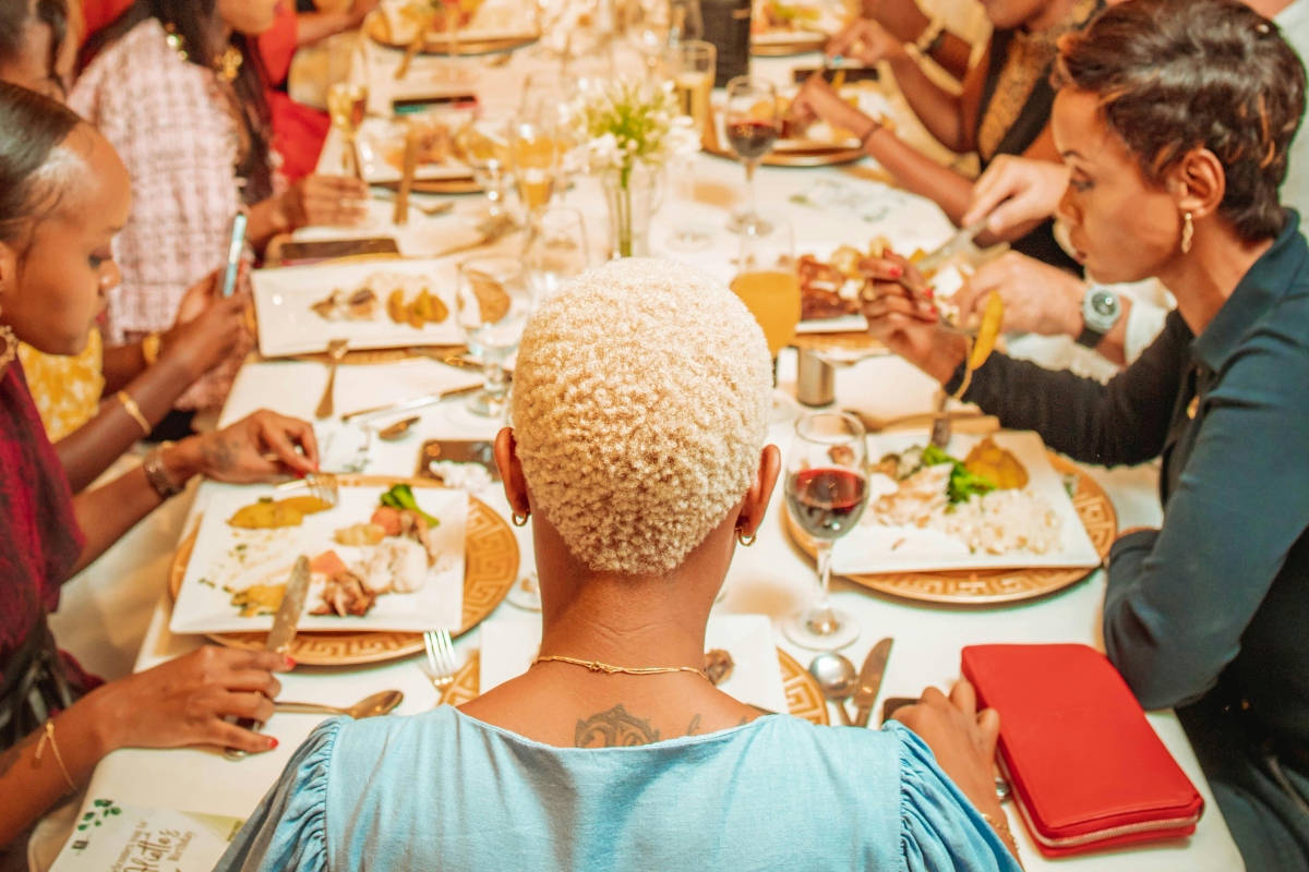 Family Sitting Together by Table