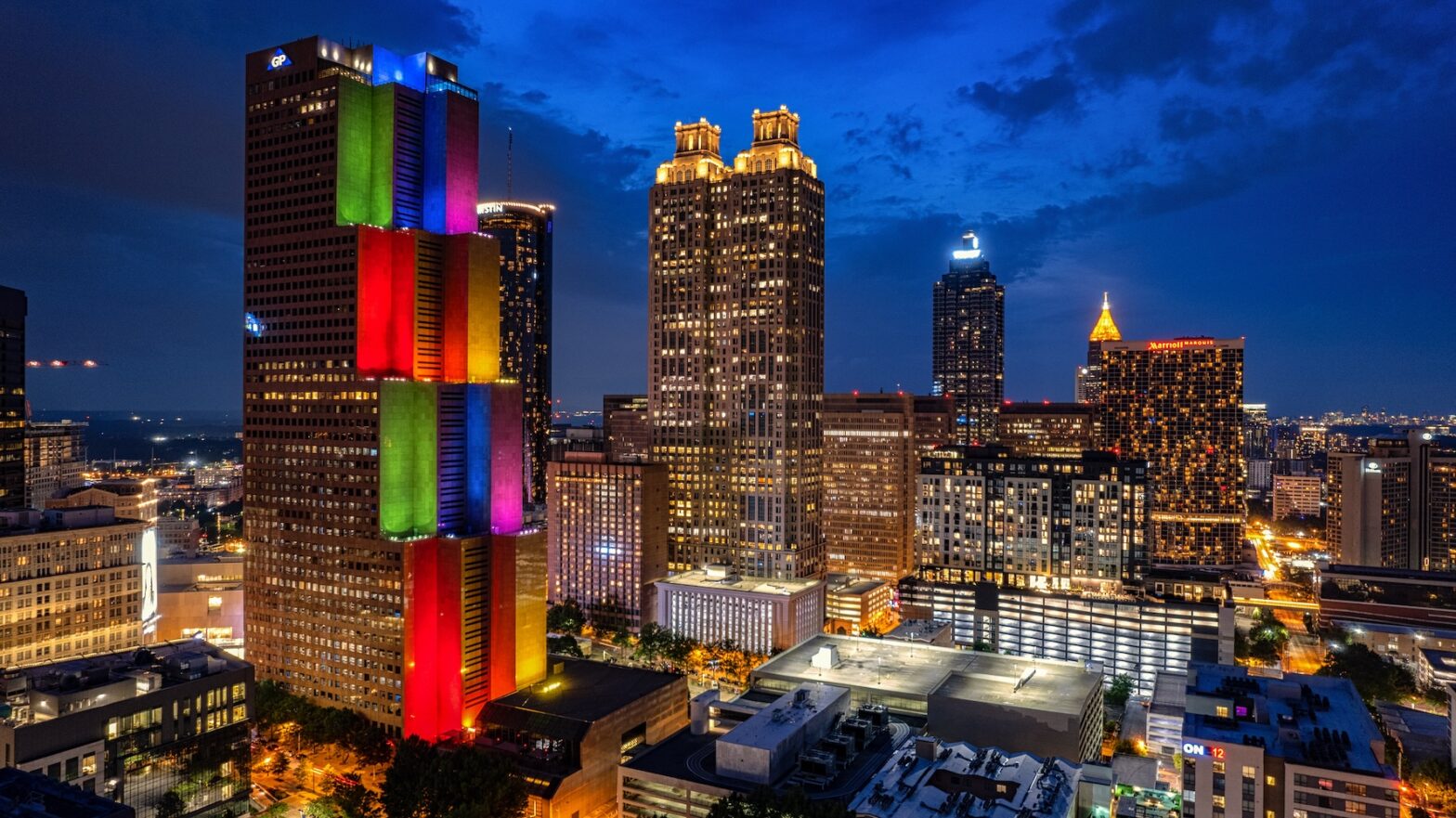 Atlanta building illuminated with LGBTQ colors during Pride.