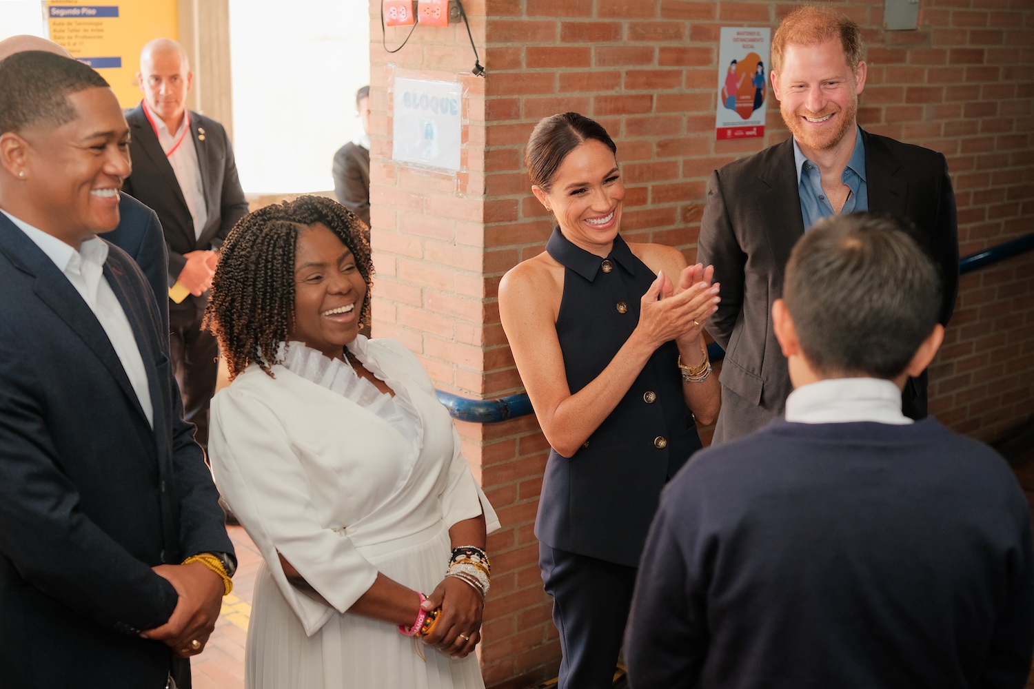 Prince Harry, Duke of Sussex (R), Meghan, Duchess of Sussex (C-R) and Vice President Francia Márquez (C-L) and her husband Yerney Pinillo (L) visit local charter school, Colegio Cultura Popular, on August 15, 2024 in Bogota, Colombia.