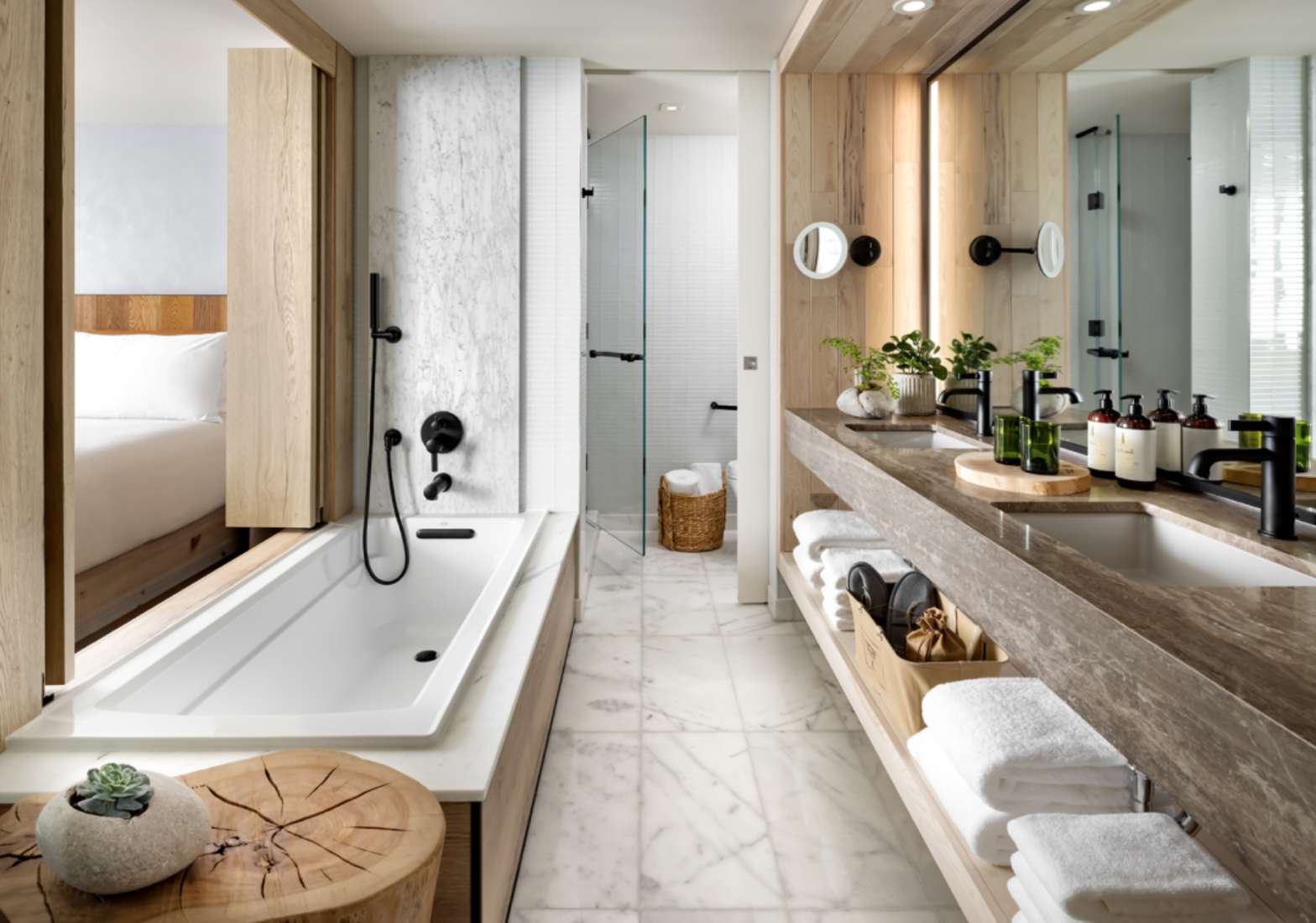 large bathroom with long bathtub and vanity countertop put luggage in the bathtub