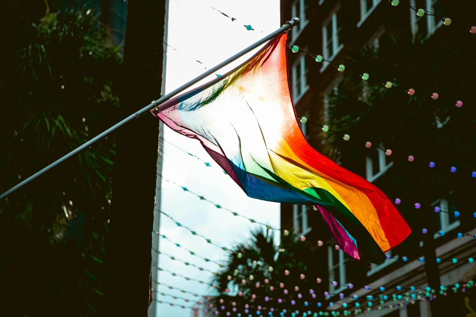 A situation is unfolding as the public learns that authorities removed LGBTQIA+ travel info from a prominent Florida website. pictured: pride flag in Florida