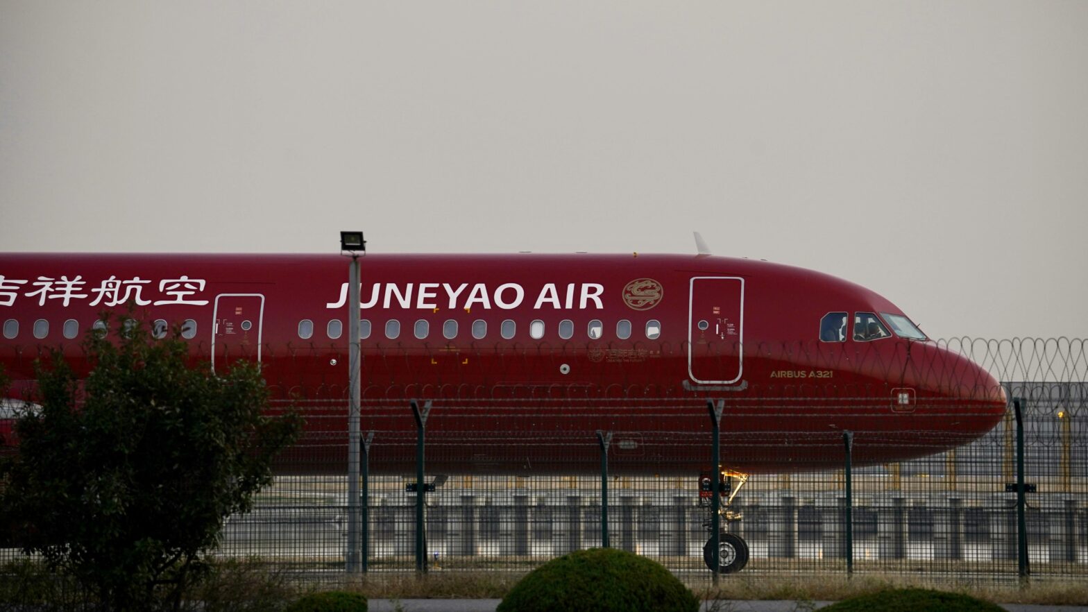 Women in China caused controversy when they locked a child in plane lavatory. pictured: Juneyao Air