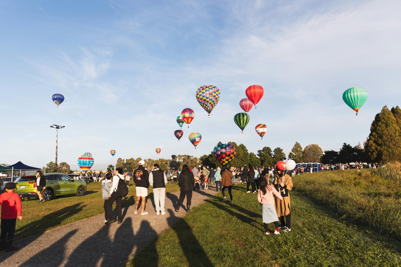 people having fun at a public park during fall festival