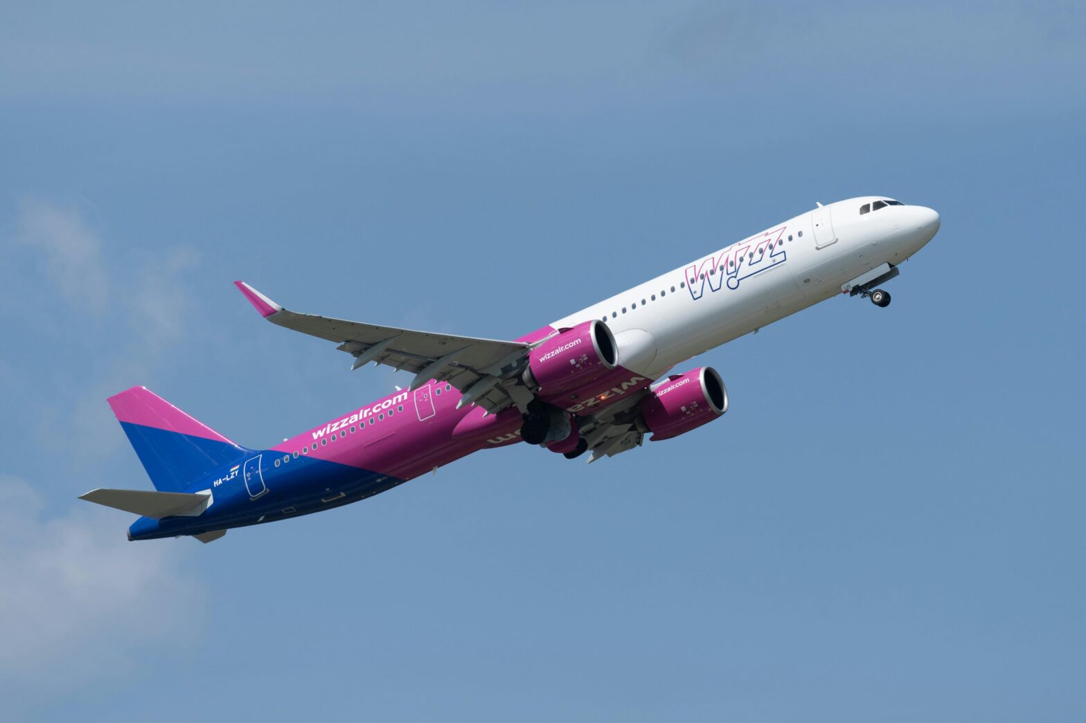 Wizz Air aircraft taking off during sunny day