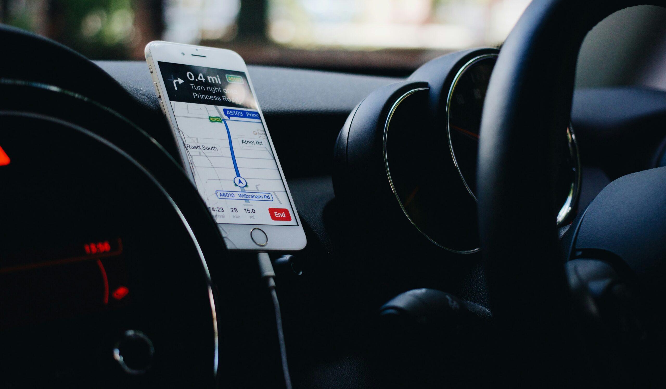 This is how travelers should embark on a fall road trip. 
pictured: road trip with phone map